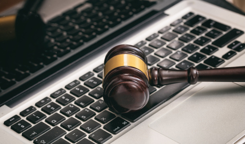 auction-or-judge-gavel-on-a-laptop-2024-12-07-22-08-15-utc