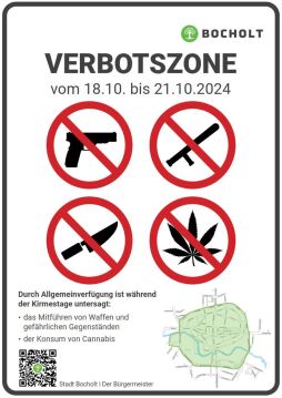  Signs point out that weapons, dangerous objects and cannabis consumption are prohibited at the Bocholt funfair. 